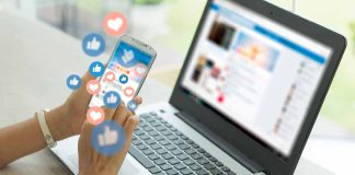 Person using smartphone with social media notifications