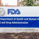 FDA building sign with logos outside.