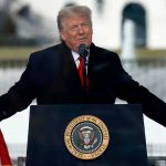 How the Panama Canal Shapes U.S. Security and Influences Global Trade Person speaking at a podium with microphones.