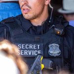 Secret Service agent in uniform with equipment visible