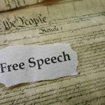 Elon Musk’s X Policy: Balancing Monetization and Free Speech Debate Old document with text Free Speech overlay