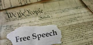 Old document with text Free Speech overlay