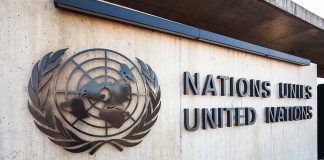 United Nations sign and emblem on building wall