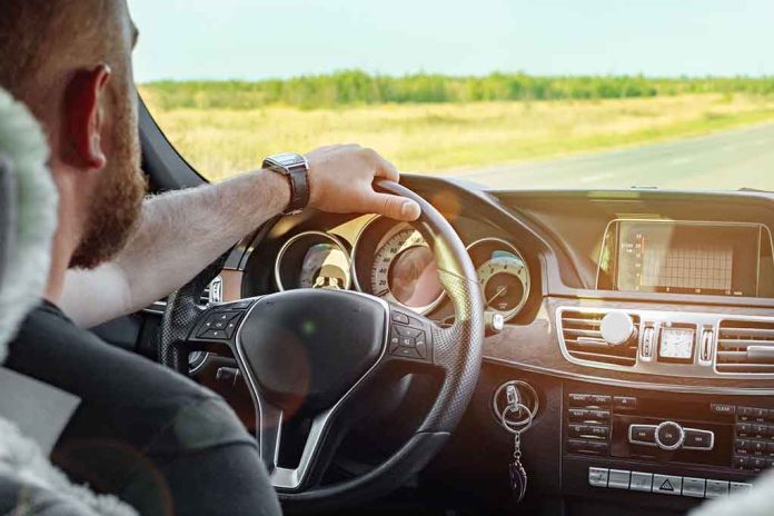 1240838257 featured image Person driving a car on a sunny day.