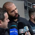 Florida Investigation Focuses on Andrew Tate: Unveiling Political Ties and Scandals Group of men with microphones outside a building