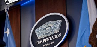 Pentagon Washington emblem with flags in background