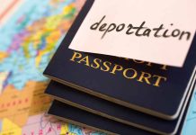 Passports stacked with deportation note on top.