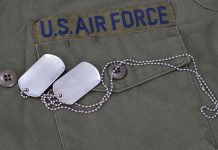 Military jacket with dog tags on the pocket.