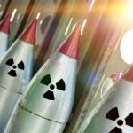 U.S. Tactical Nukes in Focus as China Expands Military Influence Line of nuclear missiles with radiation hazard signs.