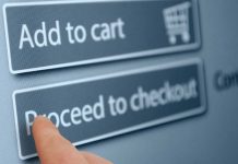 Finger tapping proceed to checkout button online