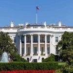 White House with American flag and garden