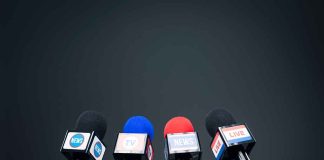 Microphones set up for a news conference