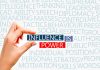 Hand holding block text influence is power