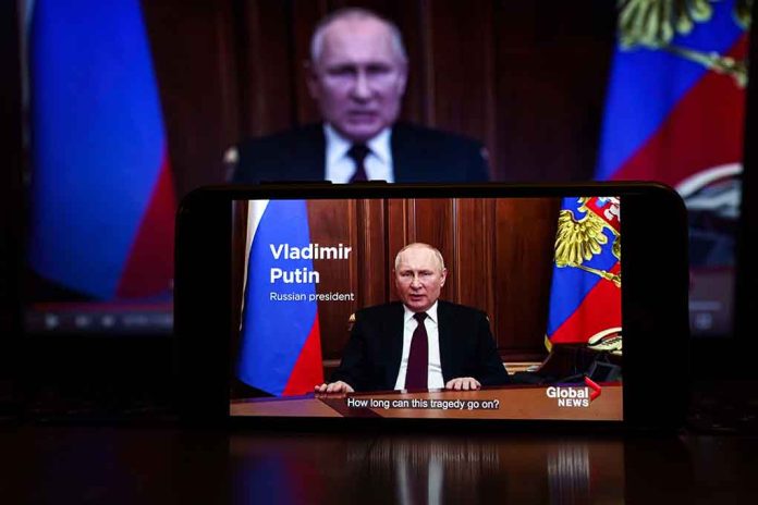 2127643805 featured image Man speaking on screen with Russian flag background.