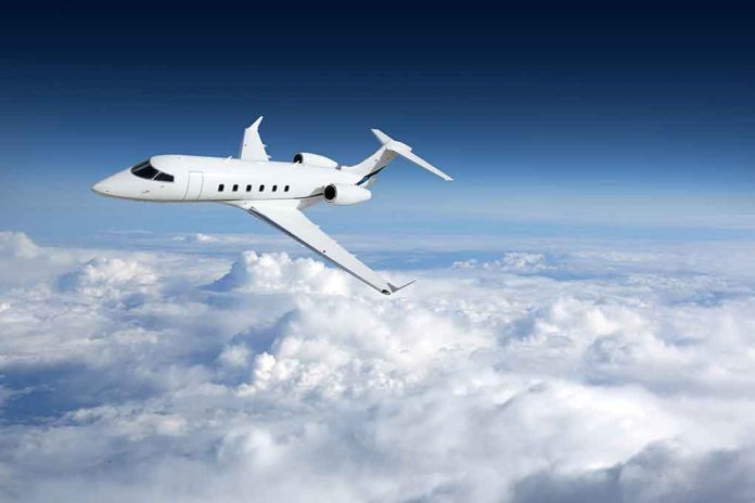 758054764 featured image Private jet flying above the clouds.