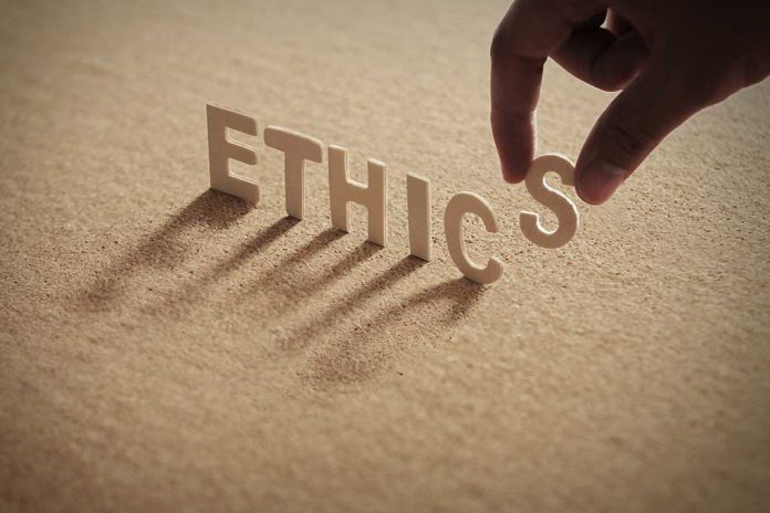 759448675 featured image Hand placing the letter S in the word ETHICS.