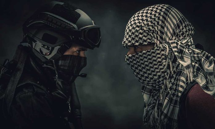 1401390242 featured image Two masked figures face each other dramatic lighting