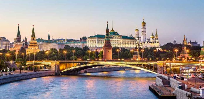 1419194690 featured image Illuminated bridge and Kremlin complex across river at twilight