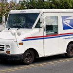 Digital Era Meets Tradition: The Big USPS Shakeup Under David Steiner USPS mail truck driving down the street