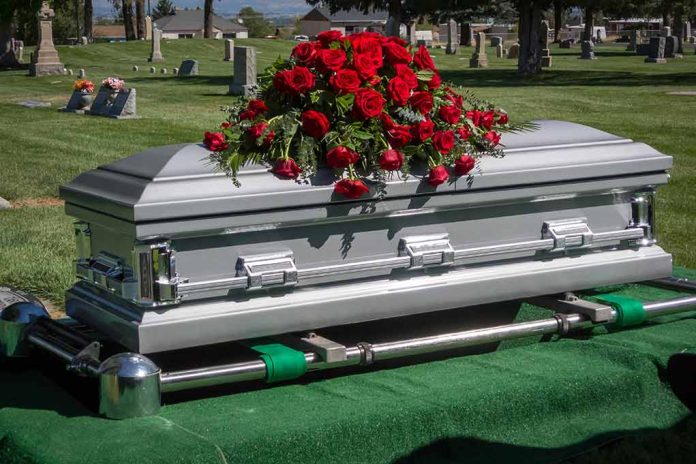 1751948510 featured image Silver casket with rose bouquet in a cemetery