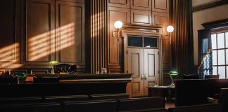 Empty courtroom with judge bench and wooden decor