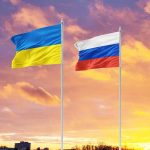 Tensions Mount as May 9 Approaches: The High-Stakes Diplomacy Between Russia and Ukraine Ukrainian and Russian flags against sunset sky