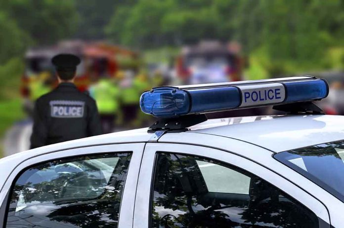 299407196 featured image Police car and officer at a scene.