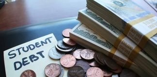 Note with student debt coins and banknotes