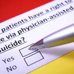Exploring Controversies: New York’s Journey with Medical Aid in Dying Legislation Survey on physician-assisted suicide options, pen hovering.