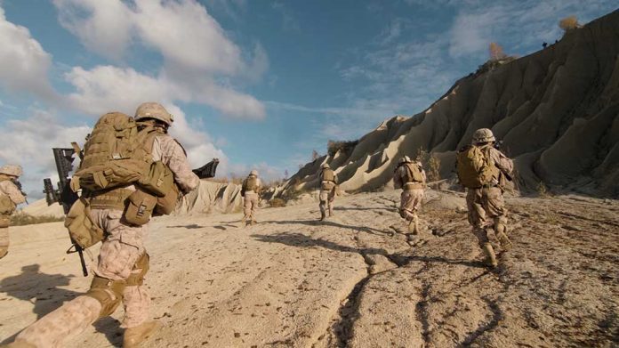 675995536 featured image Soldiers running on rocky terrain with backpacks