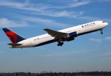 Delta airplane taking off from runway