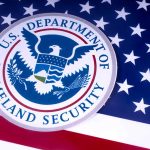 Department of Homeland Security seal on American flag