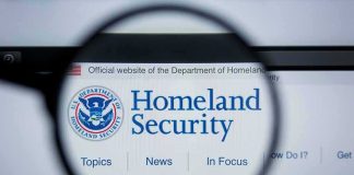 Magnifying glass showing Homeland Security website