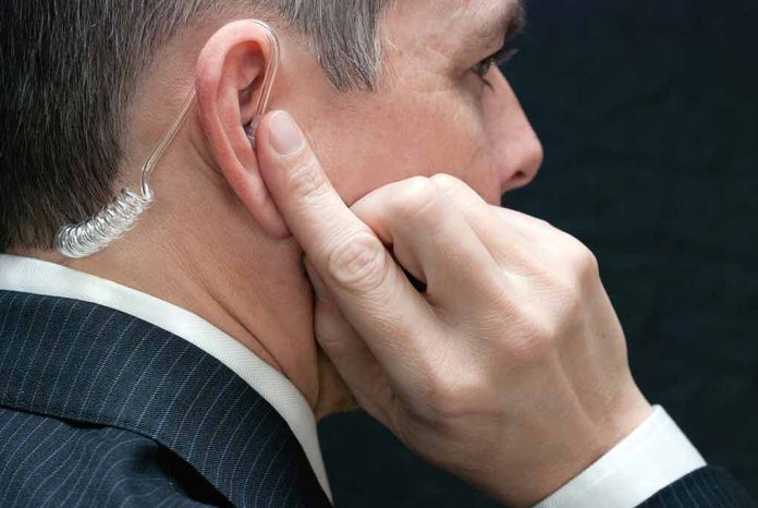 172646540 featured image Man with earpiece listening intently.