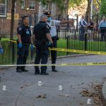 Police officers at a crime scene investigation outdoors