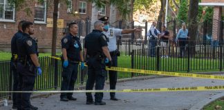 Police officers at a crime scene investigation outdoors