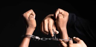 Handling handcuffs and unlocking with a key