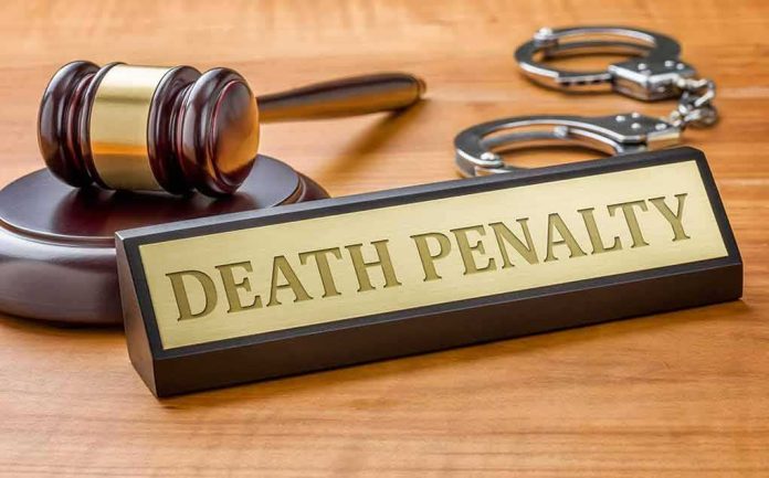 346370309 featured image Gavel handcuffs and Death Penalty sign on desk