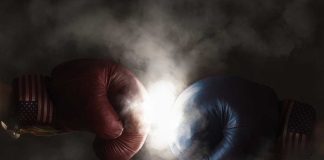 Red and blue boxing gloves clashing with smoke