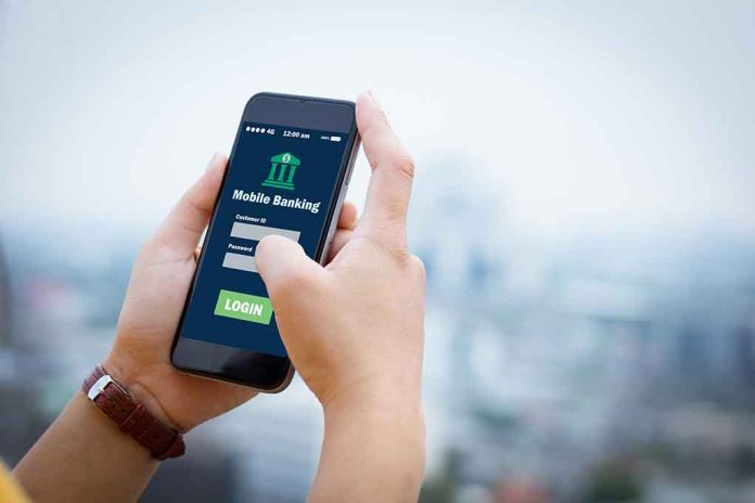 564088018 featured image Person using mobile banking app on smartphone
