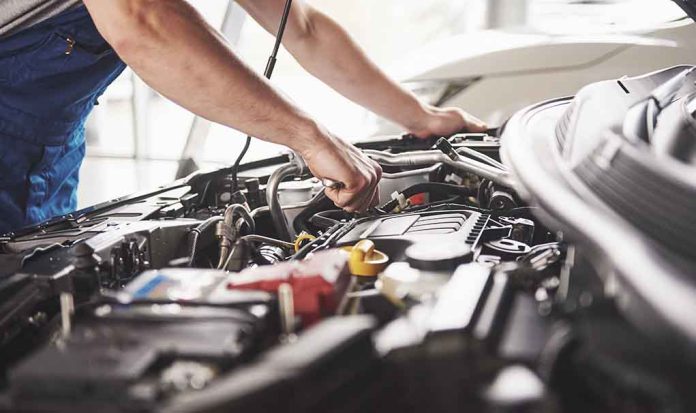 759448675 featured image Mechanic working on an engine in a car