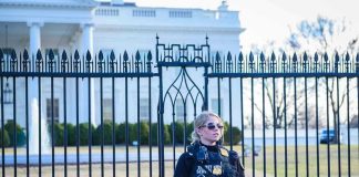 Secret Service agent stands guard outside the White House