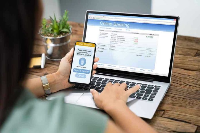 Person using online banking on laptop and smartphone