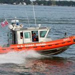 Coast Guard boat speeding on the water