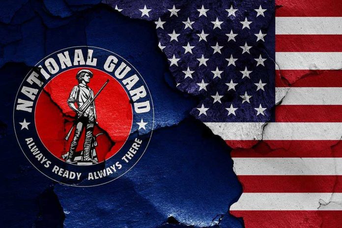 1787937674 National Guard logo over a distressed American flag.