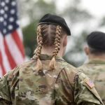 Soldier with braided hair in uniform