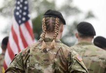 Soldier with braided hair in uniform