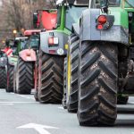 Tractors lined up on a city street