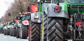 Tractors lined up on a city street