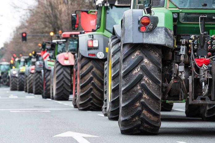 2134418091 Tractors lined up on a city street